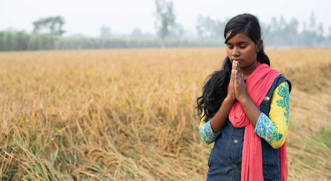 an older girl prays